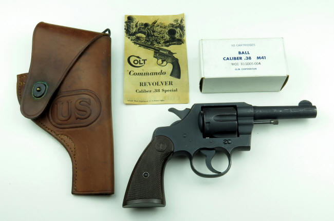 Colt commando .38 composit of pamphlet, ammo box, holster
